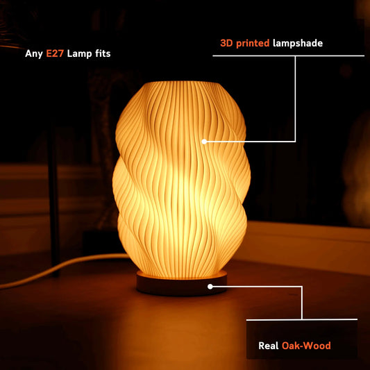 Helix 3D printed table lamp with spiral design and oak wood base glowing warmly on a window sill.